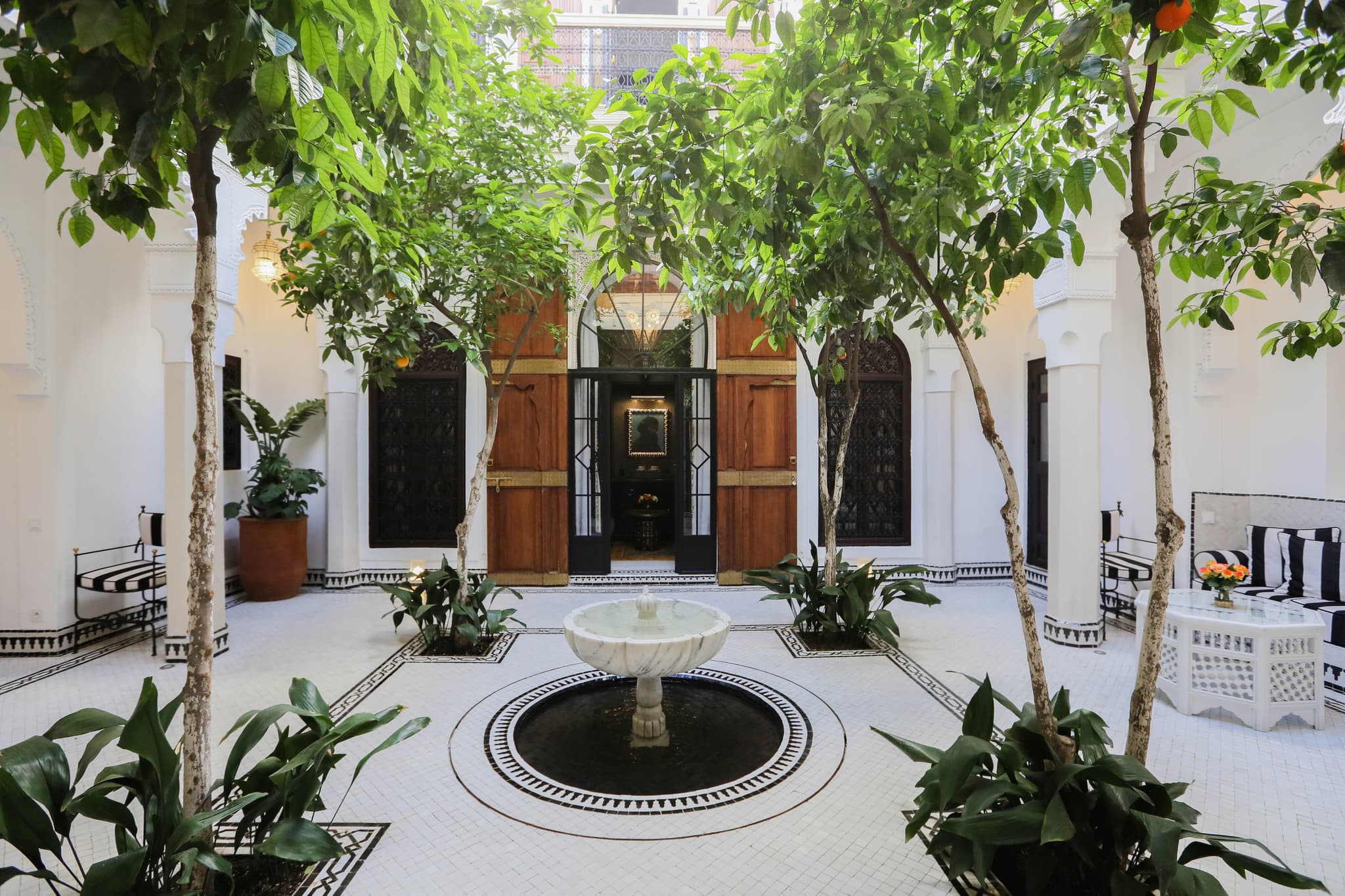 Riad patio with fountain and citrus trees